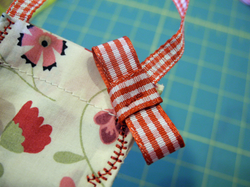 tack bow in place