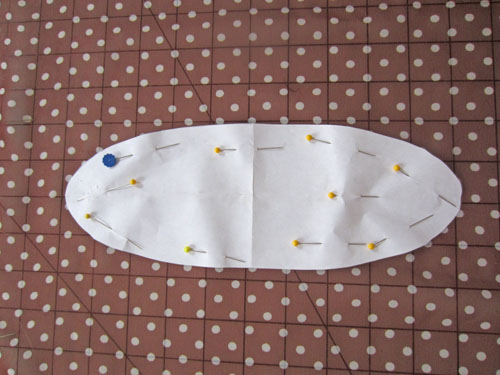 neckline pattern pinned to fabric