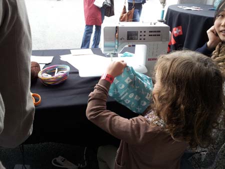 maker faire 2012 - little girl w bag- 450px wide