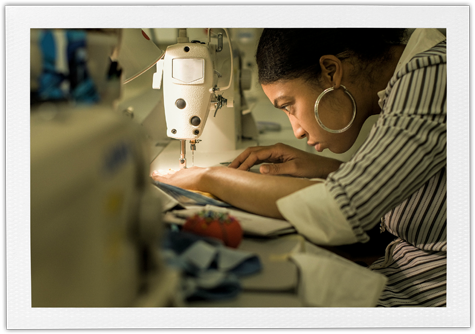 give and get back - woman at sewing machine 450px wide B