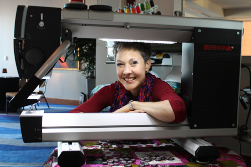 jennifer in long arm machine on frame 500px