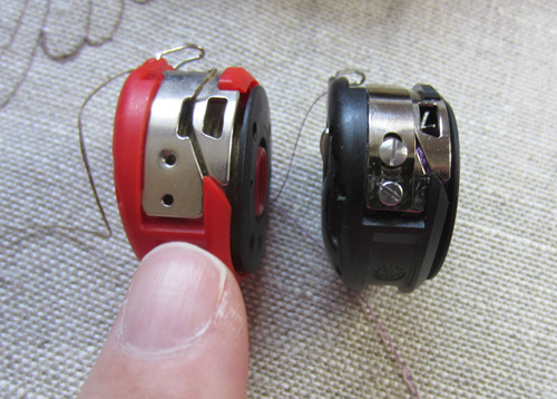 red bobbin and regular bobbin