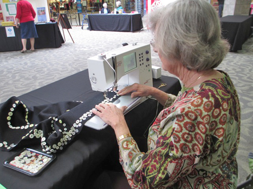 Georgia Bonesteel sewing on buttons