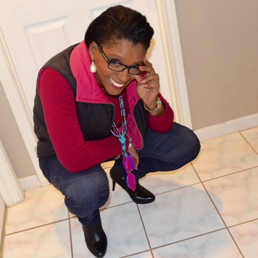 wearing black and pink down vest