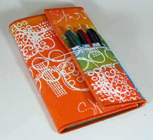notebook folio with pens