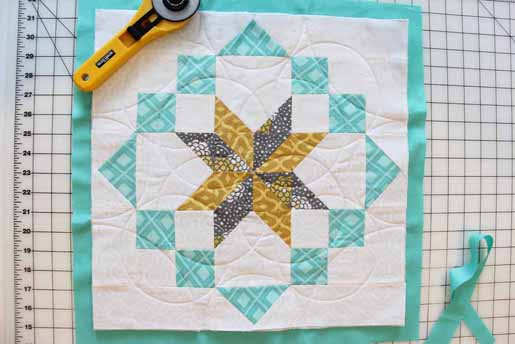 remove excess batting on all sides of the quilt