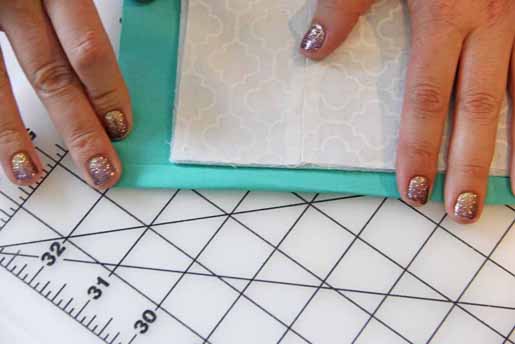 Fold in edge of backing fabric to the quilt block
