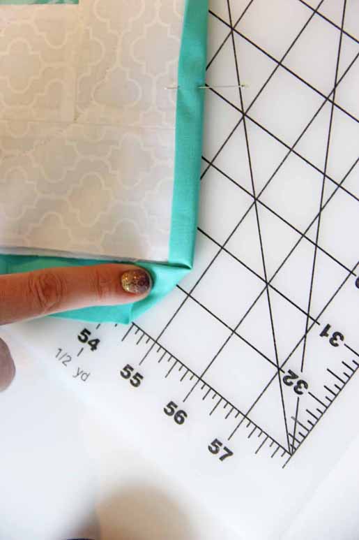 fold in the raw edge right to the edge of the block