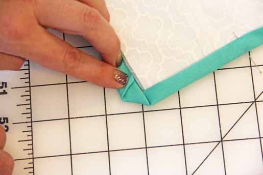 Fold in dog ear when binding your quilt