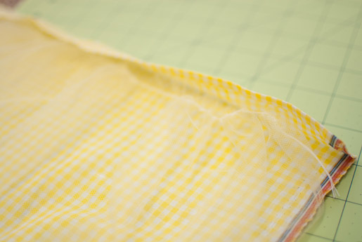 Placing the tulle right under the folded edge