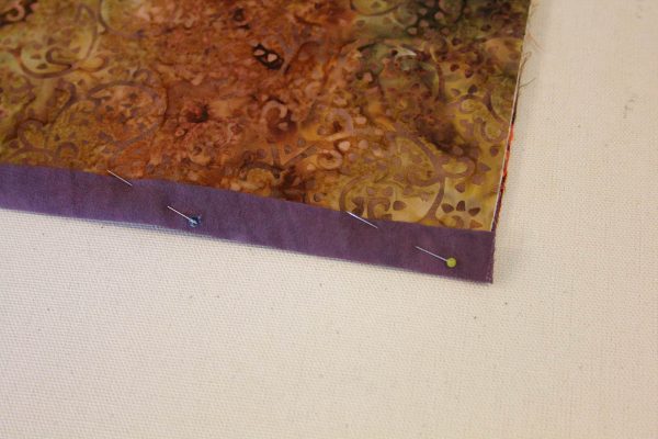 Fabric Message Board Tutorial - pin the binding strips in place