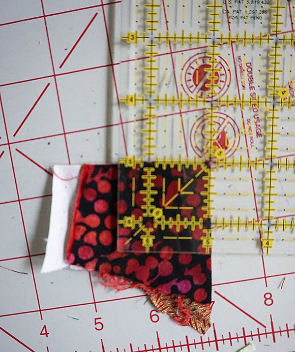 Postage stamp patchwork pillow