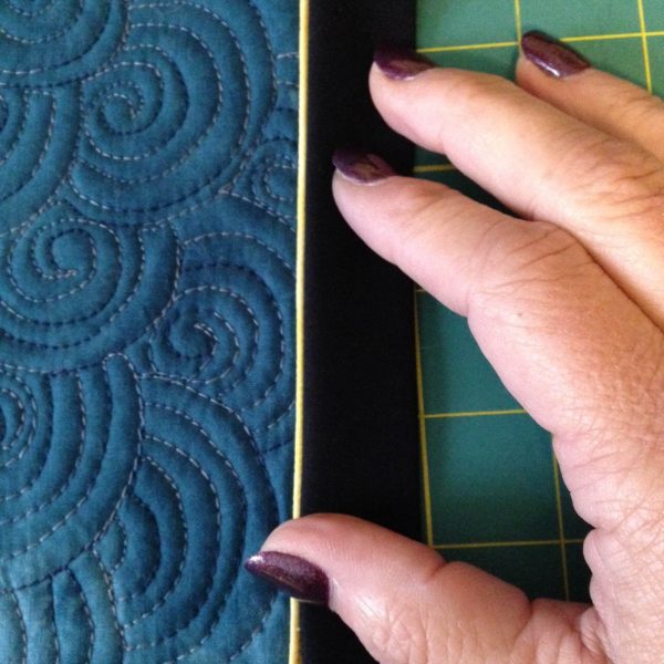 Moon Wall Hanging-piping on the front of the quilt