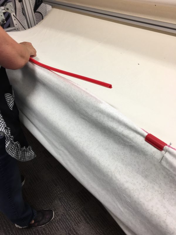 Attaching top edge of backing fabric