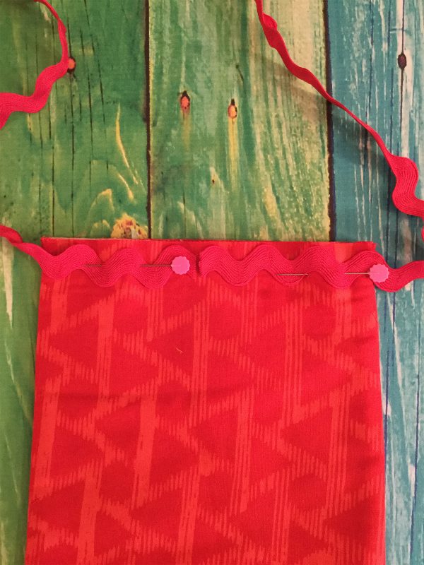 Jingle Bell Door Banner - Pinning ric rac yarn