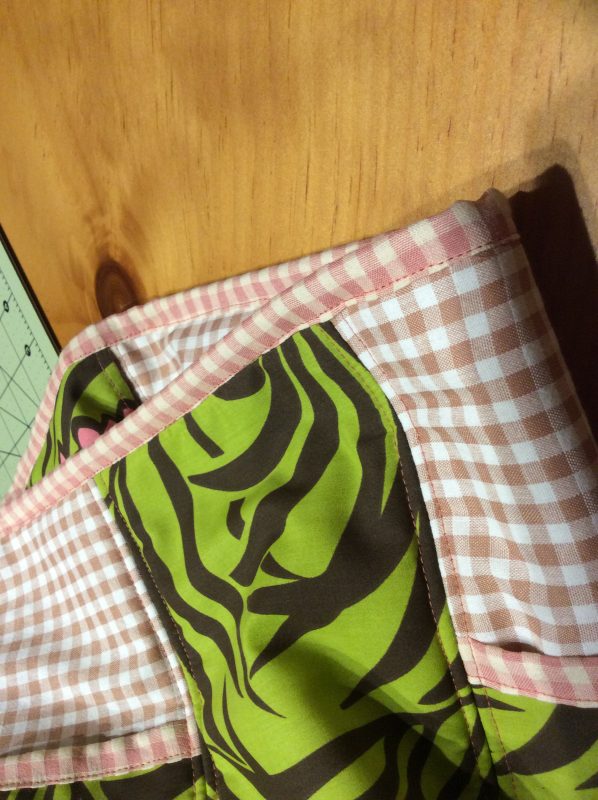 Top stitch the straps to the trim