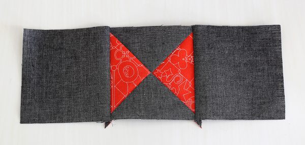 Piecing, Seam 2 gray background squares to each side of 4 orange and gray square units
