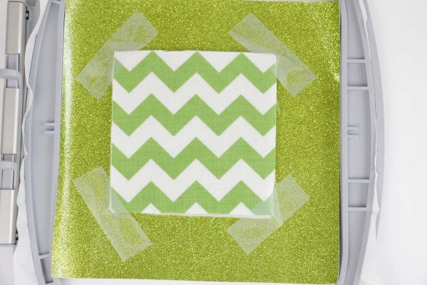 Shamrock door hanger in the hoop Step 5, Add Applique material, tape in four corners