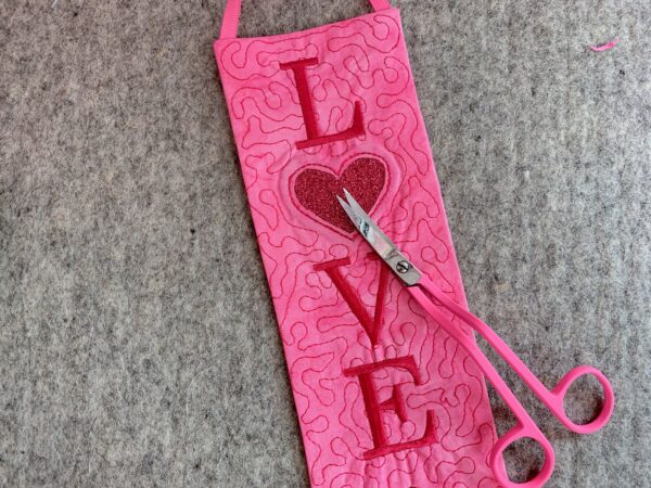 trim away the fabric within the heart