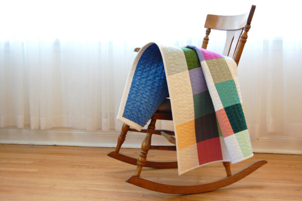 Minki Backed Patchwork Baby Quilt tutorial at WeAllSew