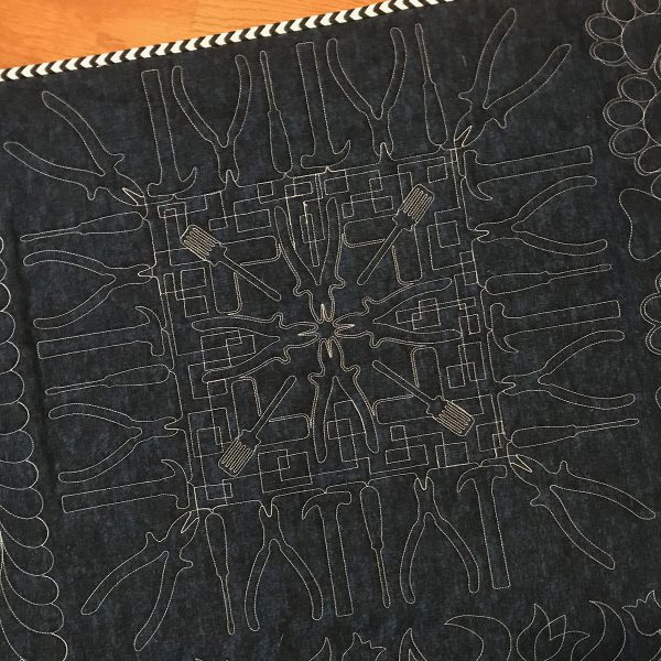 Volume 2 designs, free-motioned with rectangular meandering
