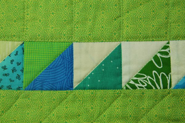 Invisible stitch in the ditch quilting with lightweight thread
