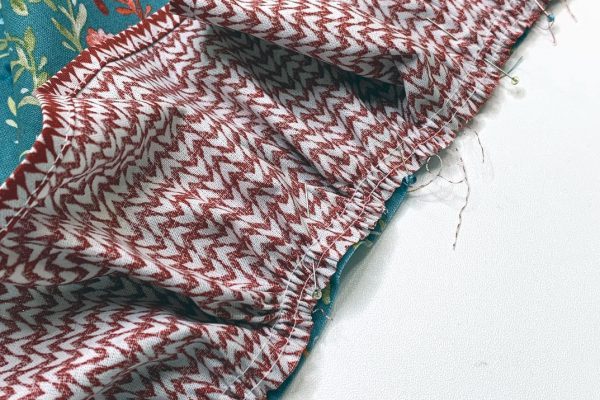Pin Ruffle to Dress Pulling Gathers to Fit