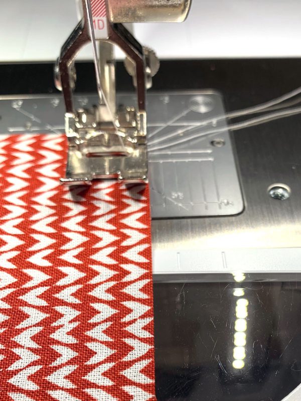 Use a long stitch length and leave a thread tail
