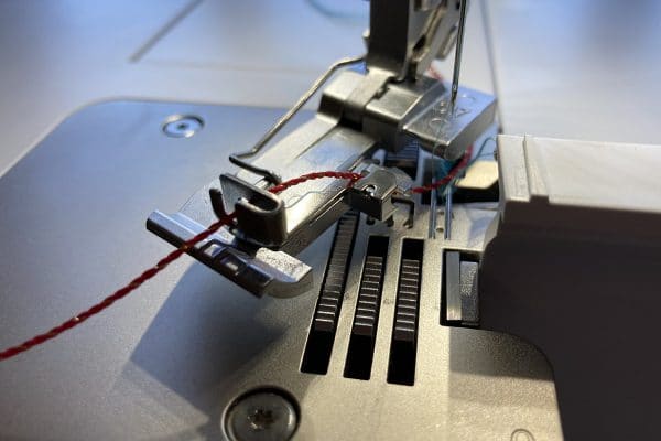 Overlocker_Jewelry_04_Cord_inserted_into_foot_BERNINA_WeAllSew_Blog_1200x800px