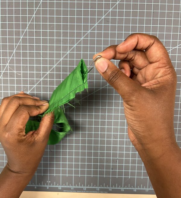 Step 2: Using the safety pin flip the fabric tube to the right side. Iron flat