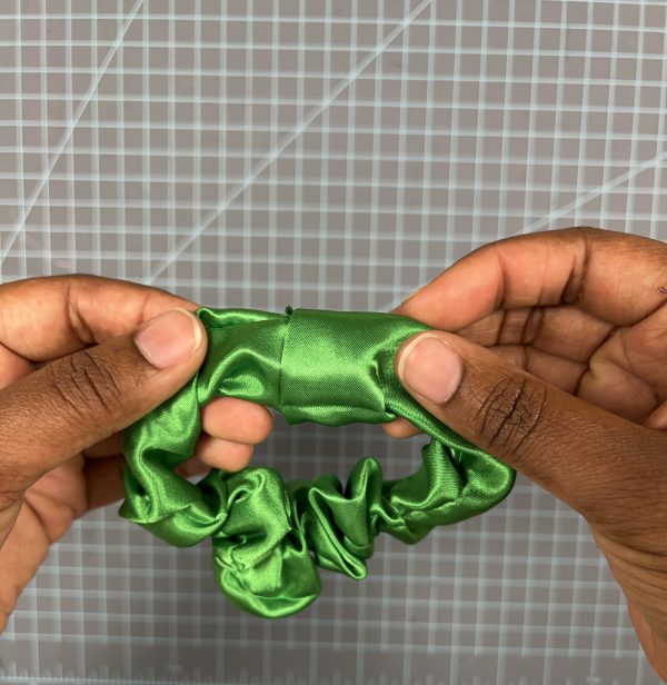 Step 5: Tuck the raw edge of your tube into the folded edge. Topstich closed