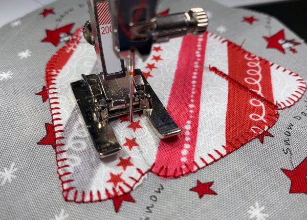 satin stitch to define neckband and sleeves