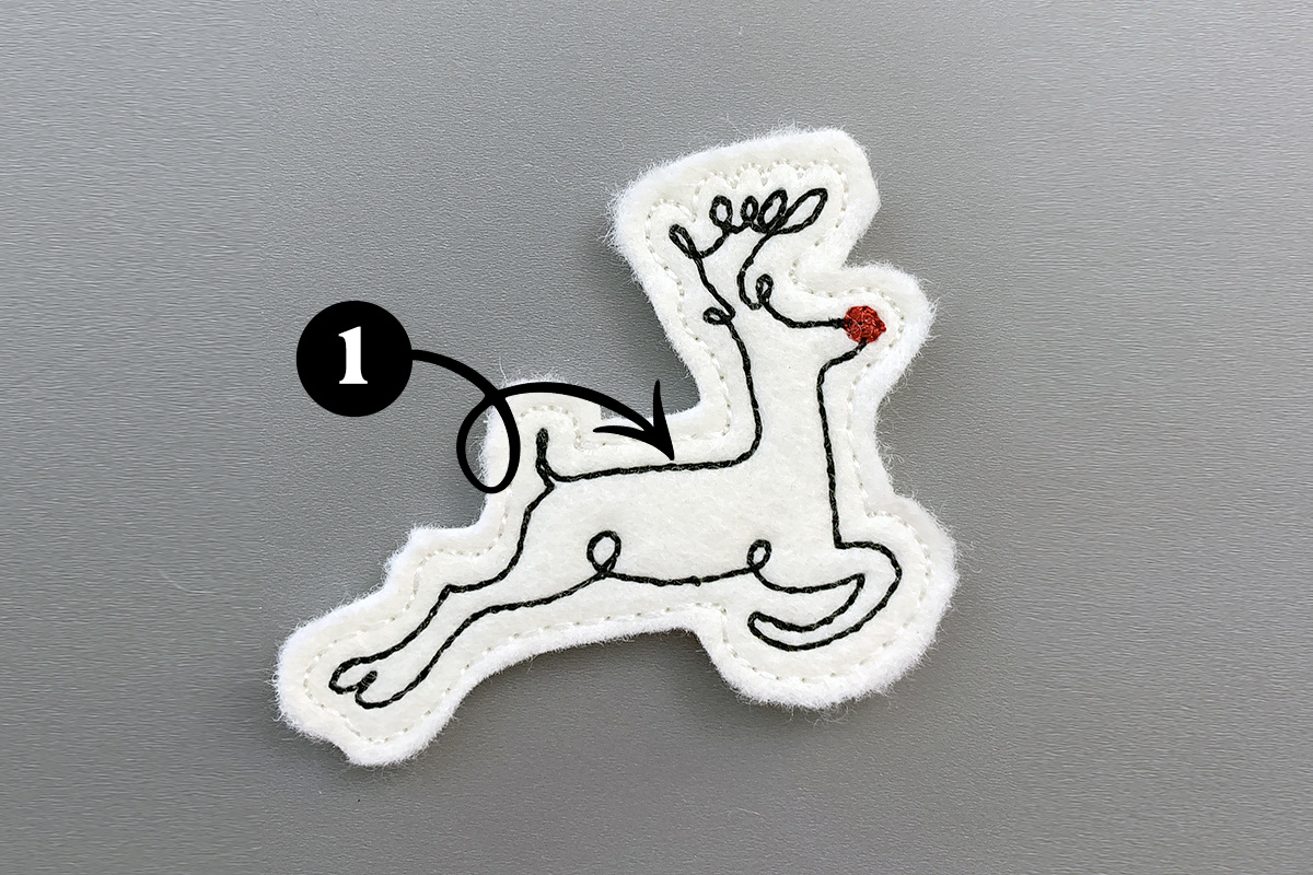 Callout indicating the first color run for the reindeer feltie is black.