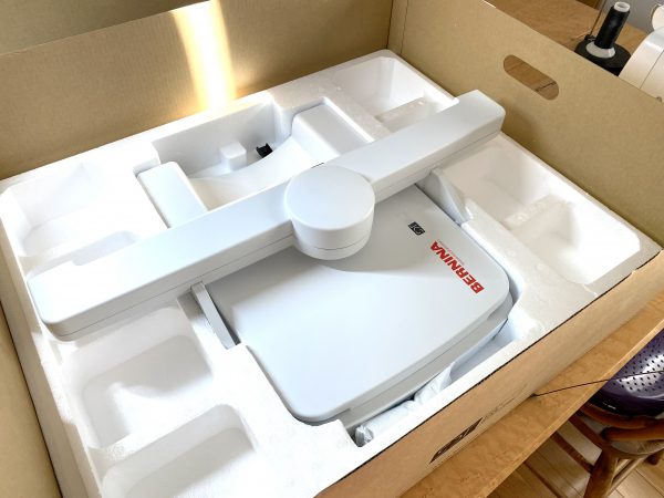 The embroidery unit is safely packed in the bottom layer of the shipping box.
