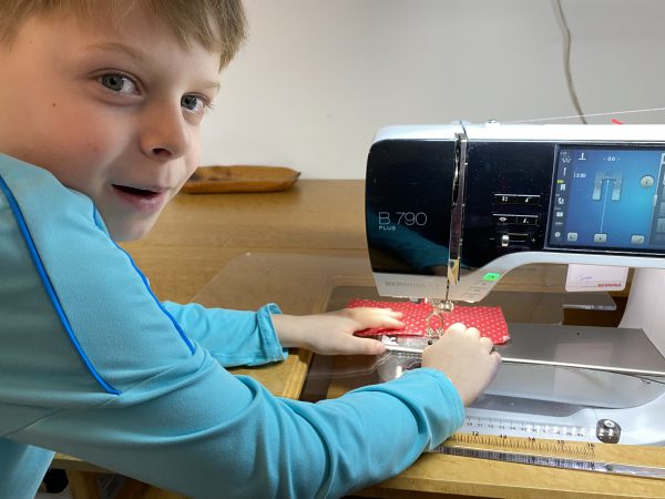 Eight year old grandson can safely sew on machine with speed lever set on slow stitches.