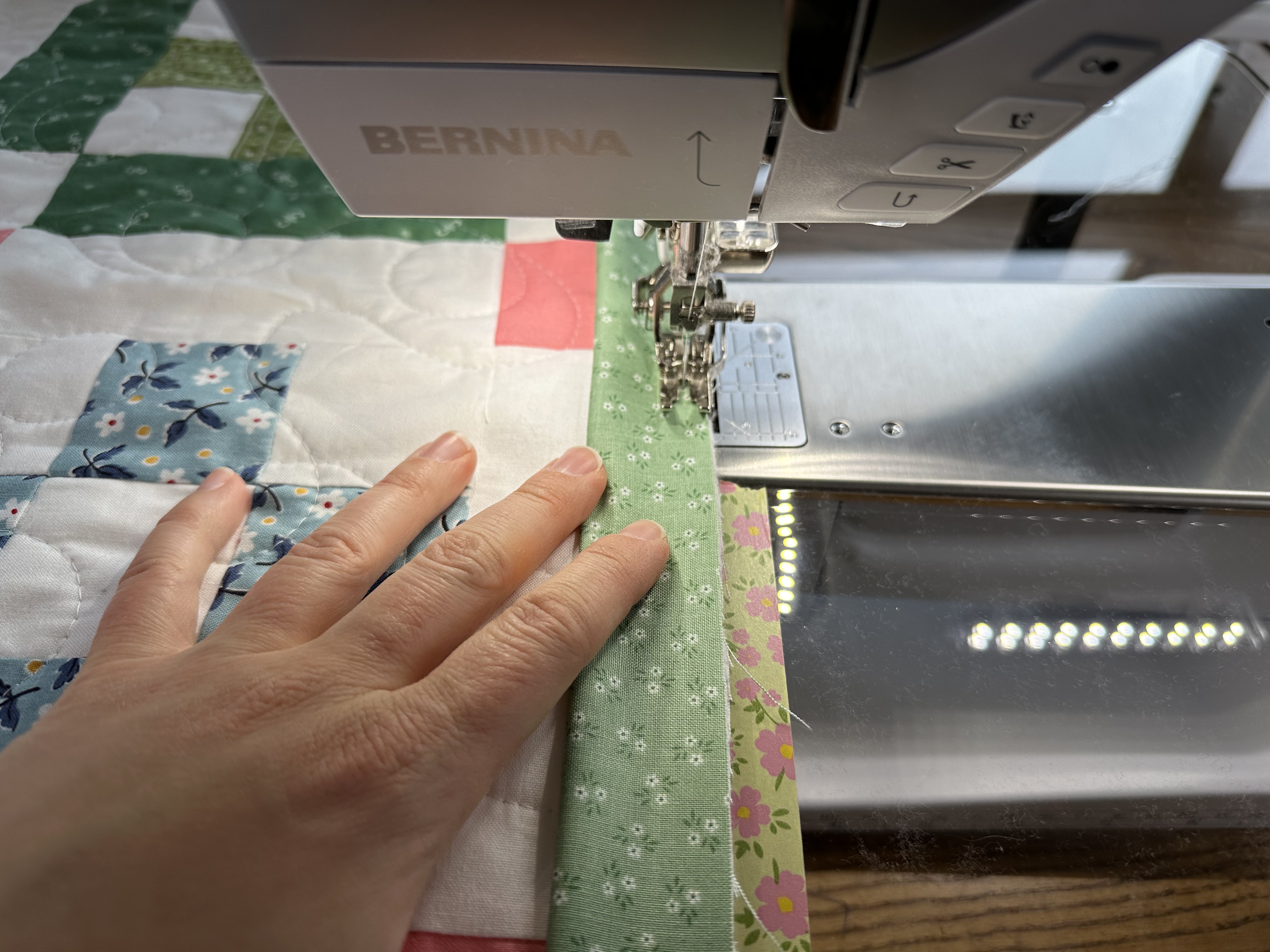 Attaching the binding for the Nona Quilt Along BERNINA WeAll Sew blog