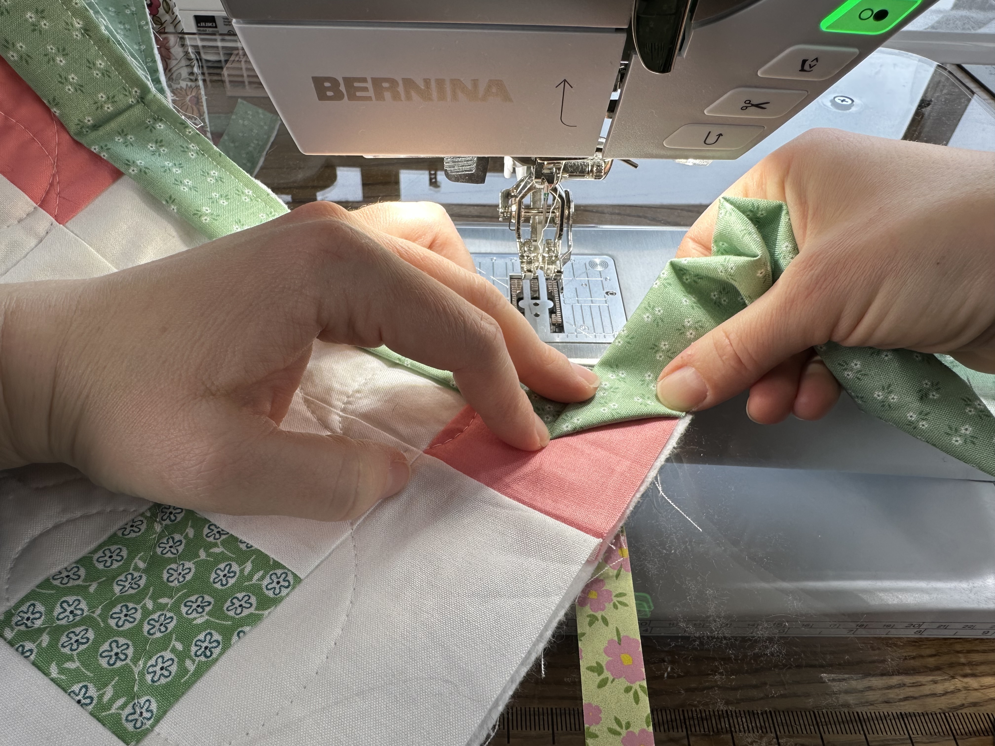 Binding a corner for the Nona Quilt Along BERNINA WeAll Sew blog