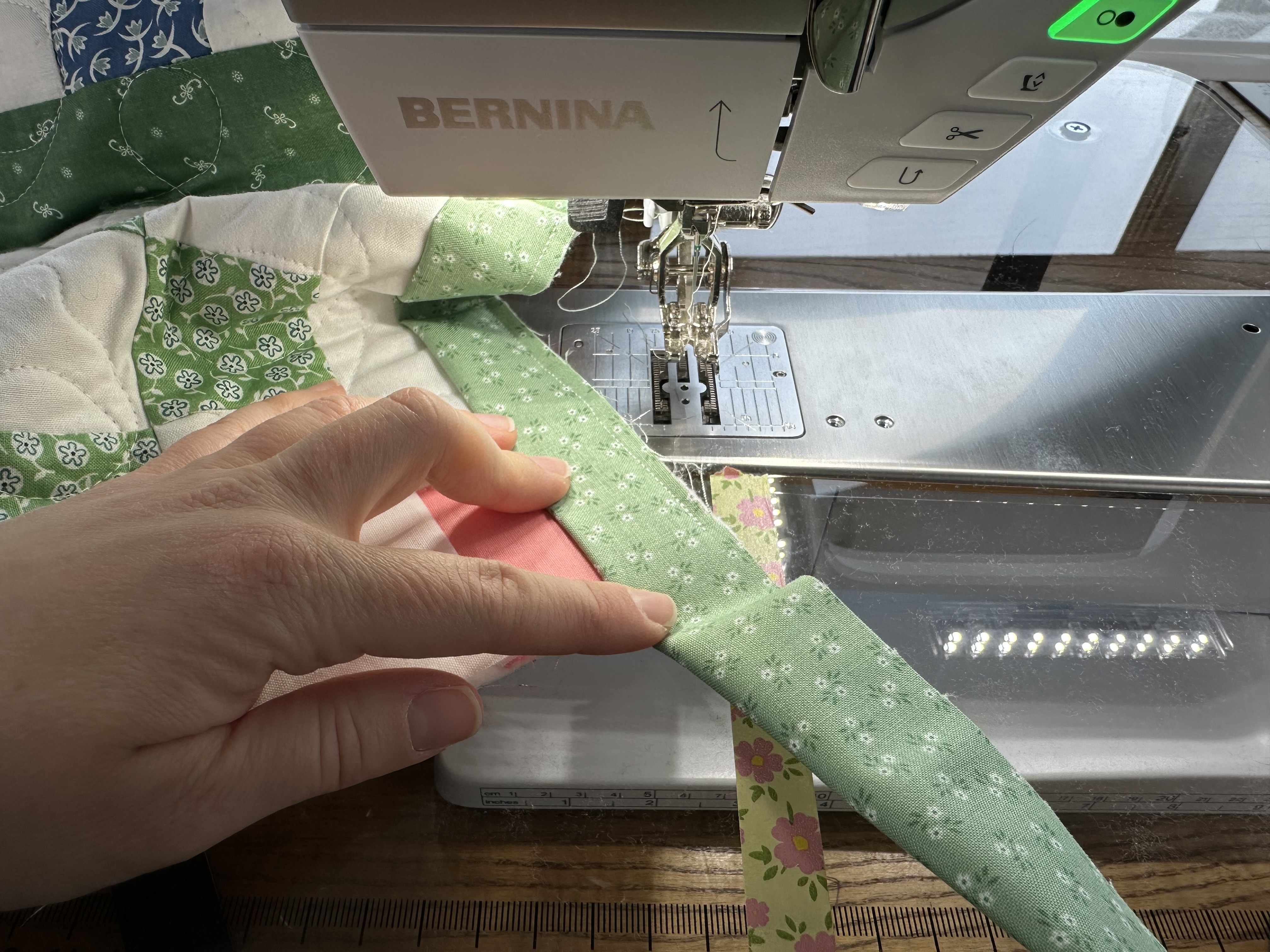 Binding a corner for the Nona Quilt Along BERNINA WeAll Sew blog