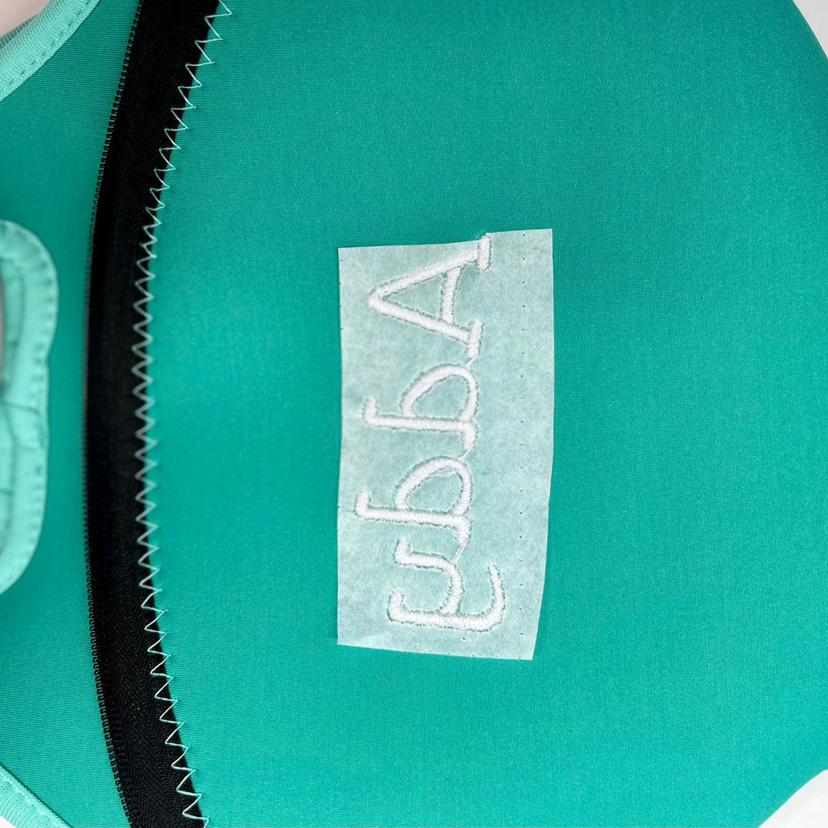 Neoprene_Lunch_Tote_Embroidery_26_cut_excess_stabilzer_inside_bag_BERNINA_WeAllSew_Blog_1200x1200px.JPEG