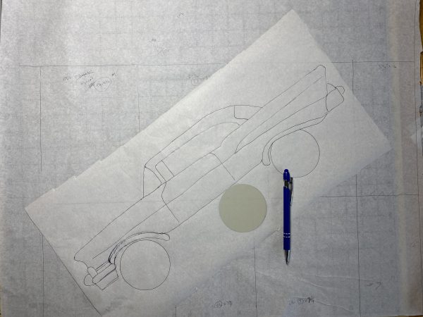 Pieced background shows in the bottom layer while drawing of car lays on top.