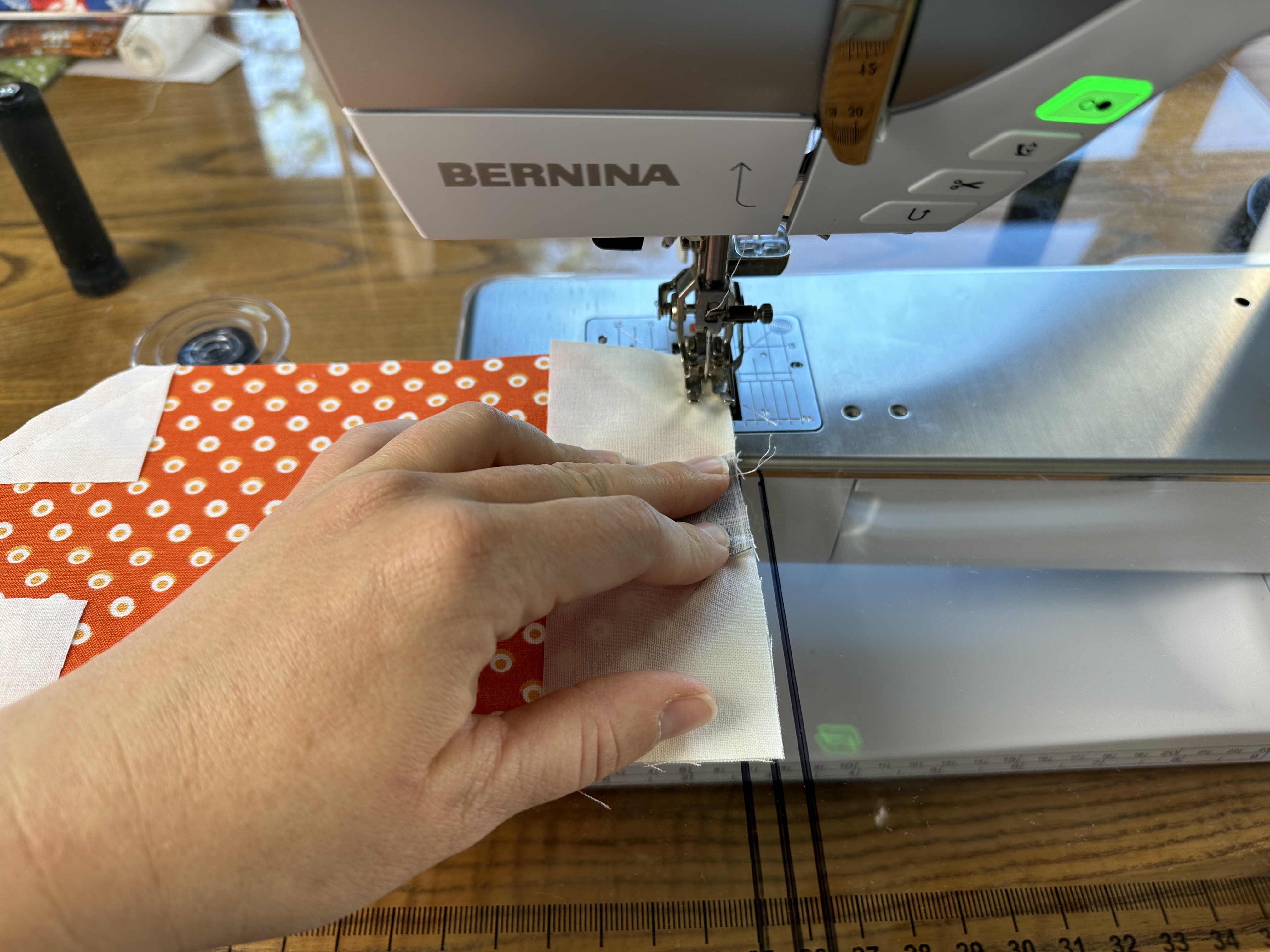 Sewing the seam of the Pumpkin Block for the Onyx in Autumn Table Runner