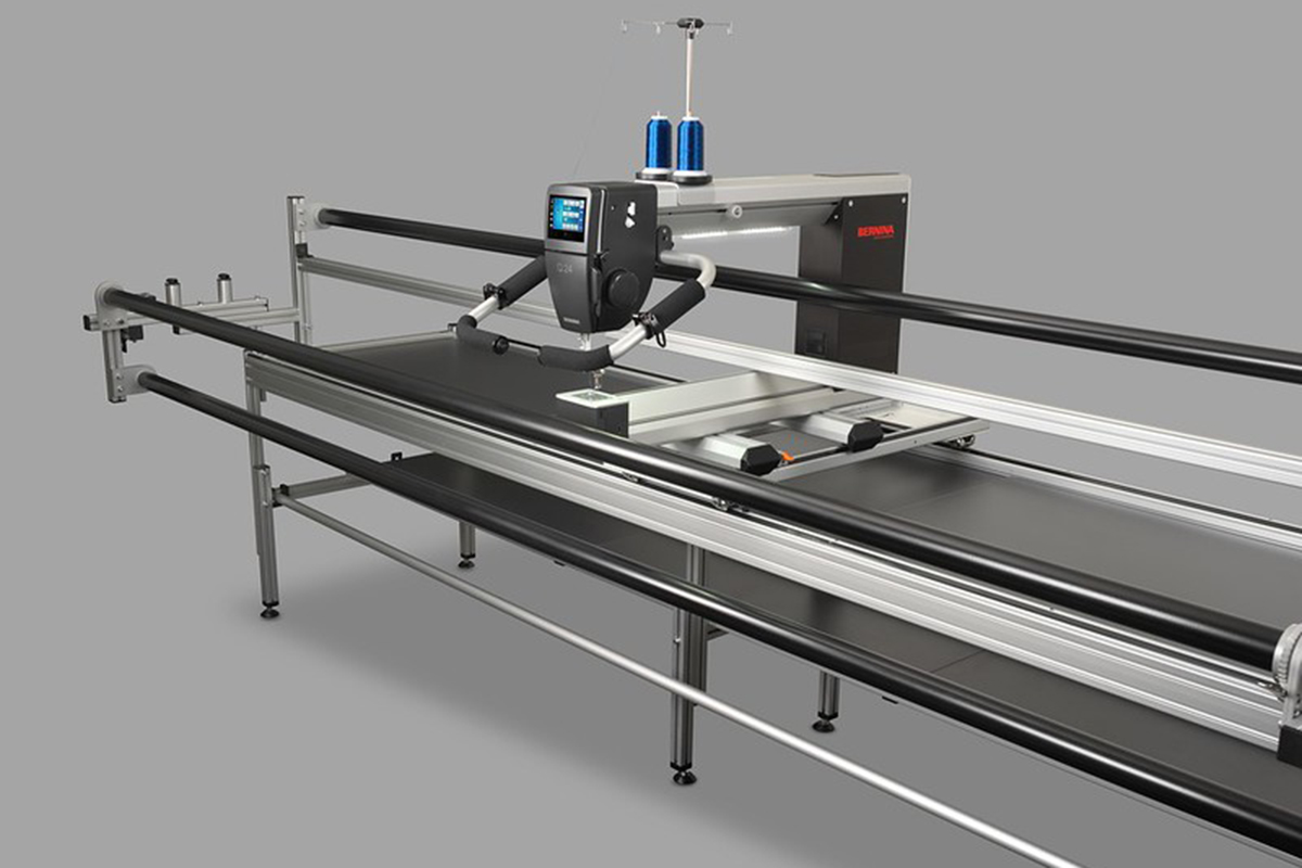 BERNINA Q Series Longarm quilting machine on a grey background.