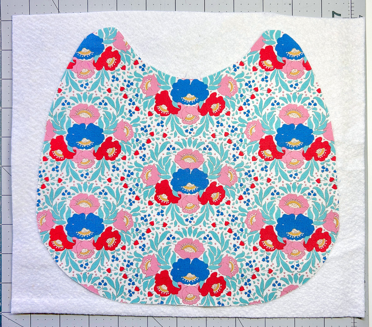 Colorful bib fabric on white batting