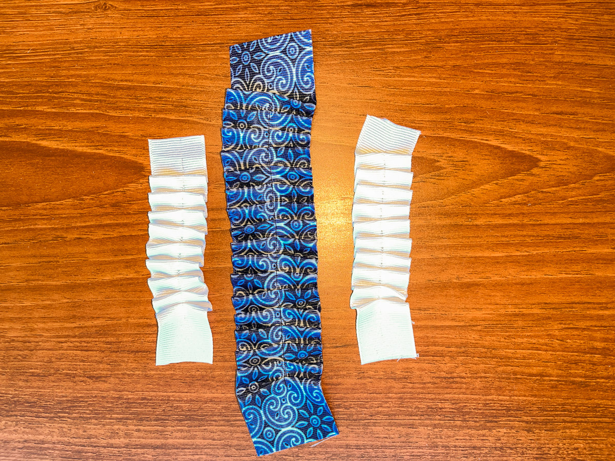 Blue and white ruffled ribbon on a wood counter