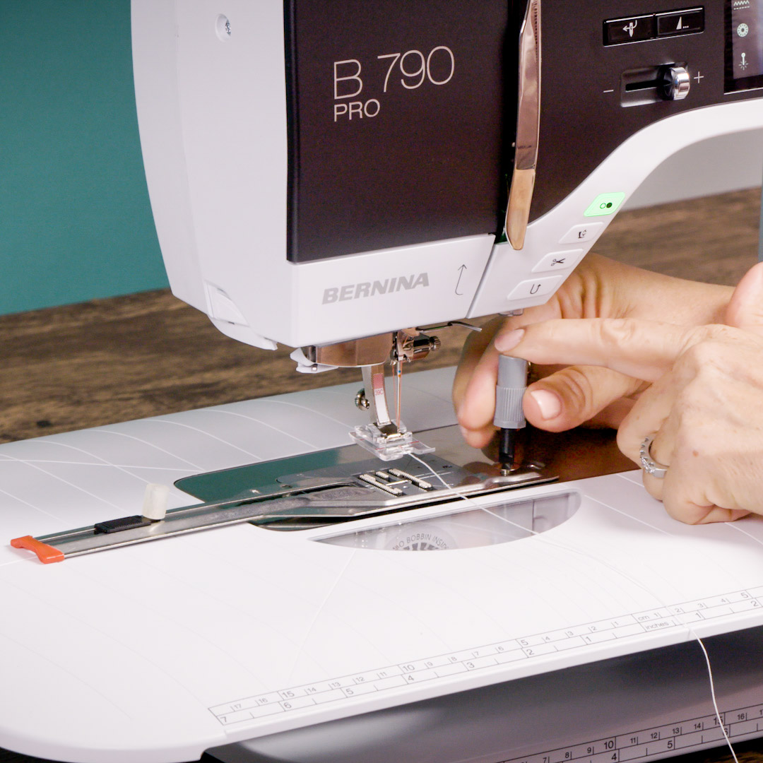 a front view of the B 790 PRO freearm, demonstrating the use of the screwdriver