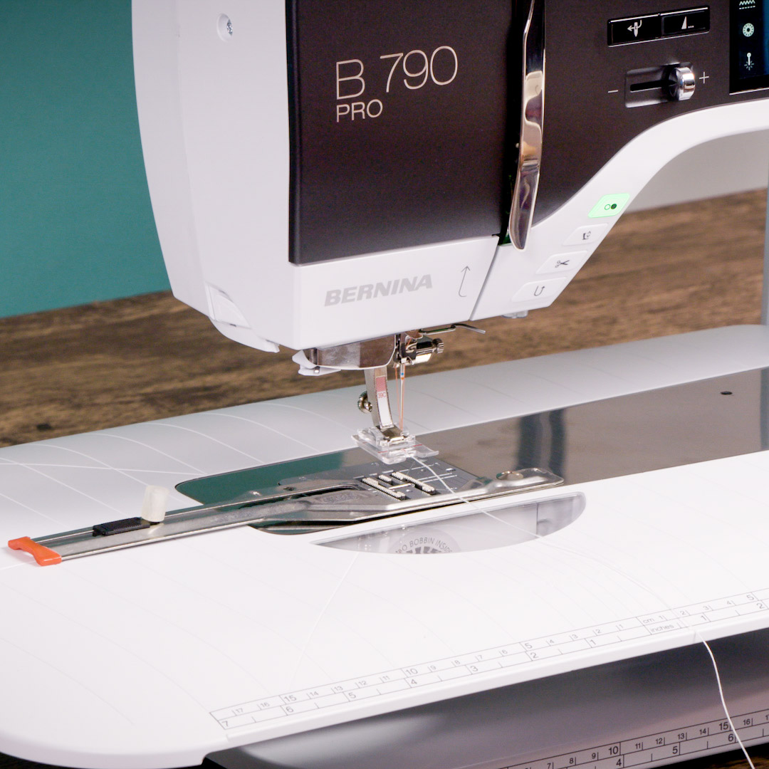 a view of the B 790 PRO with the feet and embroidery attachments in place