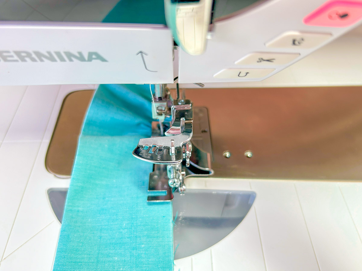 Ruffling blue fabric strip with machine