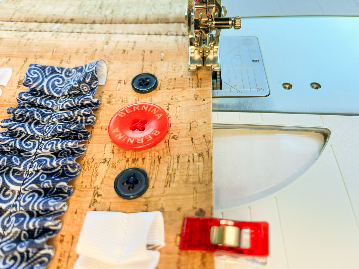 Close up view of the final side edge being sewn on the cork notebook cover