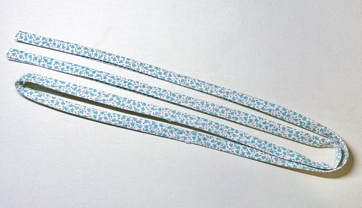 multi-color bias strips double folded on white background