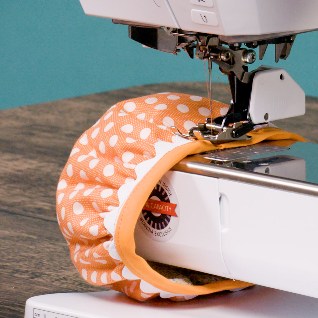 stitch down the orange bias tape after cutting and folding under